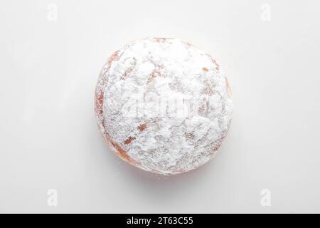 Strawberry filled jam brioche doughnut. Stock Photo