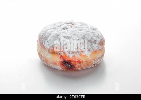 Strawberry filled jam brioche doughnut. Stock Photo