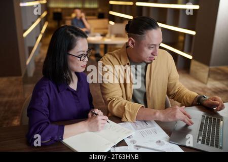 Managers of marketing department working on new development strategy Stock Photo