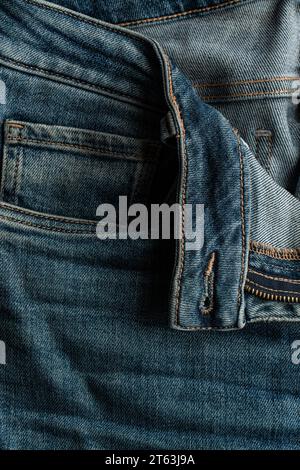 A detailed shot capturing the pocket and stitching details of a blue denim jean Stock Photo