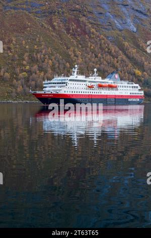 Hurtigruten MS Richard With cruiseship cruise ship at Hjorundfjorden fjord at Urke, Norway, Scandinavia, Europe in October Stock Photo