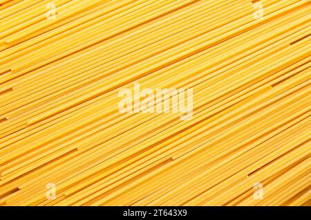 Background of spaghetti forming diagonal lines. Stock Photo