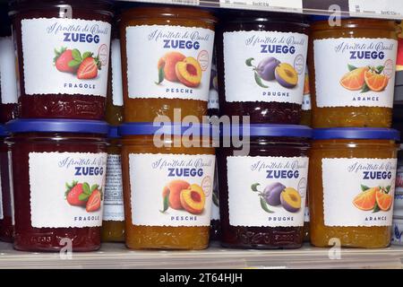 Turin, Piedmont, Italy. -08-09-2023 Jars of various flavors of fruit jam on the market shelf. Stock Photo