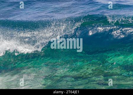 wave forming a tube, with the afternoon light, in the Atlantic Ocean Stock Photo