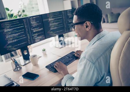Side profile shot of busy man it startuper creating new nft collection coding computer typing keyboard in modern office workstation Stock Photo