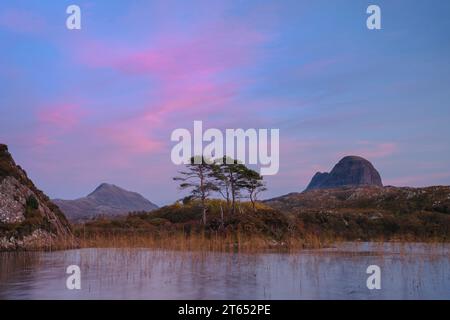 Pink clouds above the mountains of Suilven and Canisp in Assynt. Stock Photo