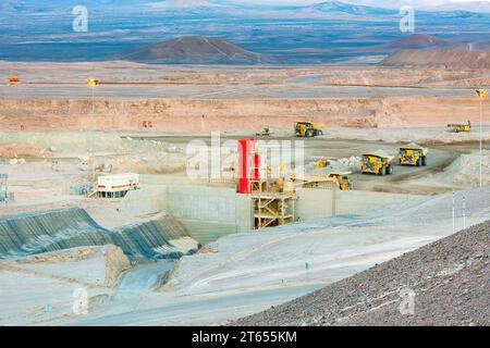Huge large dump trucks at an open-pit copper mine in Chile. Stock Photo