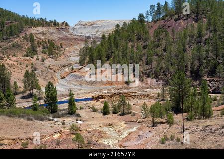 Landscape with the Tinto (red) river taht flows through pine forest and originates in the Riotinto mines. Huelva, Andalucia, Spain. Stock Photo