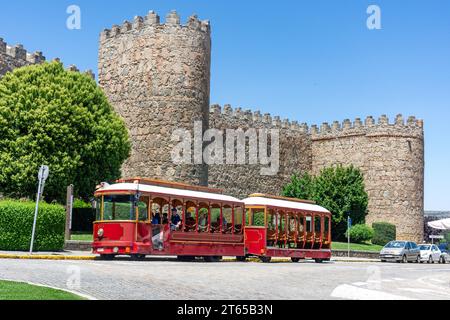 Ávila Tram by city walls (Muralla de Ávila), Calle Ronda Vieja, Ávila, Castile and León, Kingdom of Spain Stock Photo