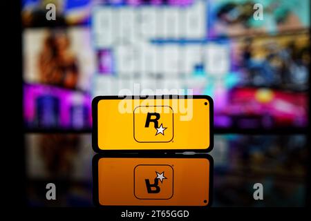 Rockstar games company logo on screen. Rockstar is international computer games developer Stock Photo