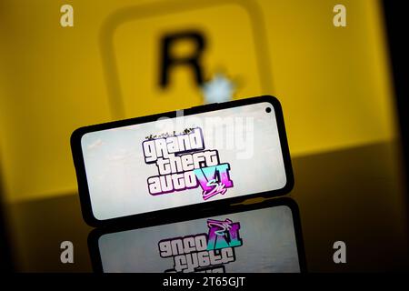 In this photo illustration a Rockstar Games logo seen displayed on a  smartphone with video games cover in the background. (Photo by Thiago  Prudencio / SOPA Images/Sipa USA Stock Photo - Alamy