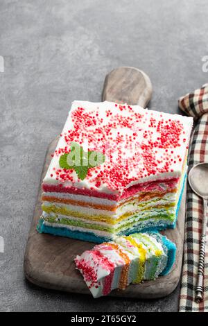 Multicolored  rainbow cake on gray background Stock Photo