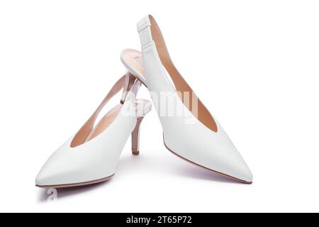 A pair of white women's leather open-back high-heeled shoes isolated on the white background. Close up view. Fashionable stylish feminine shoes, shoes Stock Photo