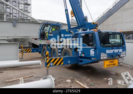 Longeville-lès-Metz, France - Blue mobile crane Demag AC 60-3 on the construction site of a stadium. Stock Photo
