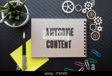 AWESOME CONTENT text on clipboard with keyboard on wooden background Stock Photo