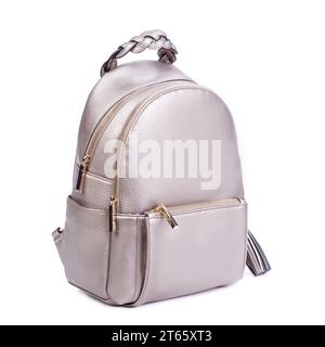 Close-up photo of trendy royal beige leather backpack with two zipped compartments and pocket with an original braided handle isolated on a white back Stock Photo