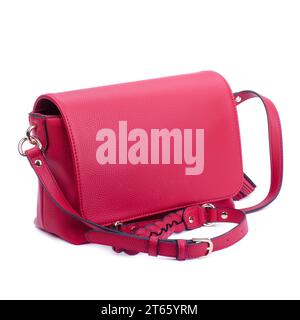 Stylish red leather women's handbag with shoulder strap with braided detail isolated over white background. Trendy accessories concept. Sale, fashion Stock Photo