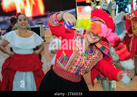 London, UK. 08th Nov, 2023. A final performance from the ArtPerUK dance group in regional costumes, as well as plenty of pisco sours served, mean the Peru booth is popular wih visitors as well as fellow exhibitors in the final hours. As every year, in the last couple of hours on the final day of World Travel Market at ExCel London many country booths and travel show stands hold informal gatherings and wrap parties to celebrate a successful three days of the trade show, often with performances, music, dancing and local food and drinks. Credit: Imageplotter/Alamy Live News Stock Photo