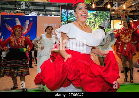 London, UK. 08th Nov, 2023. A final performance from the ArtPerUK dance group in regional costumes, as well as plenty of pisco sours served, mean the Peru booth is popular wih visitors as well as fellow exhibitors in the final hours. As every year, in the last couple of hours on the final day of World Travel Market at ExCel London many country booths and travel show stands hold informal gatherings and wrap parties to celebrate a successful three days of the trade show, often with performances, music, dancing and local food and drinks. Credit: Imageplotter/Alamy Live News Stock Photo