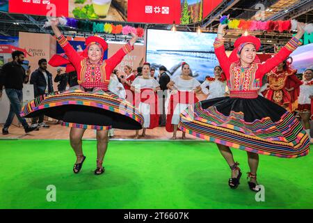 London, UK. 08th Nov, 2023. A final performance from the ArtPerUK dance group in regional costumes, as well as plenty of pisco sours served, mean the Peru booth is popular wih visitors as well as fellow exhibitors in the final hours. As every year, in the last couple of hours on the final day of World Travel Market at ExCel London many country booths and travel show stands hold informal gatherings and wrap parties to celebrate a successful three days of the trade show, often with performances, music, dancing and local food and drinks. Credit: Imageplotter/Alamy Live News Stock Photo