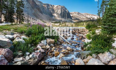 Boulder lined spillway at south end of Lake Marie in the Snowy Range area of Medicine Bow National Forest in Wyoming Stock Photo