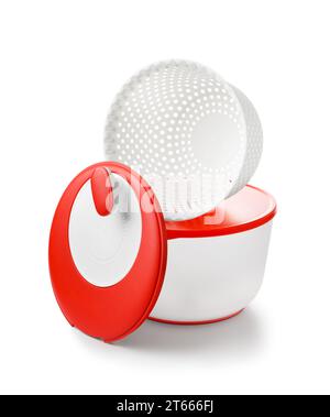 Carousel dryer, centrifuge for greens, berries made of eco-plastic. A container with an airtight lid for storing food, a sieve. Set 3 in 1. Stock Photo