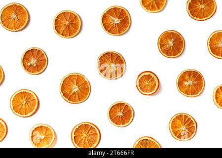 Orange chips on a white background, flat lay, top view. Dry orange slices as a background. Useful snack. Proper nutrition. Stock Photo