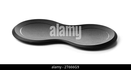 Black stand for tongs, spoons, spatulas. Convenient kitchen utensils made of eco-plastic. Stock Photo