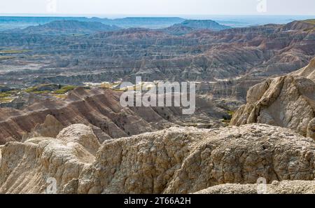 Erosion exposes colorful layers of sedimentary rock in the Badlands ...