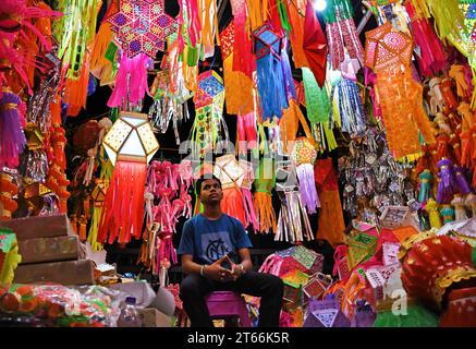 Mumbai, India. 08th Nov, 2023. A shopkeeper awaits customers to sell lanterns ahead of the Hindu festival of lights, Diwali in Mumbai. Diwali festival is celebrated by Hindus where they shop for lanterns ahead of the festival, clean their home, prepare sweets and snacks, make rangoli (traditional Indian art form where various designs are made on the floor) and light their homes with earthen lamps marking victory of light over darkness. (Photo by Ashish Vaishnav/SOPA Images/Sipa USA) Credit: Sipa USA/Alamy Live News Stock Photo