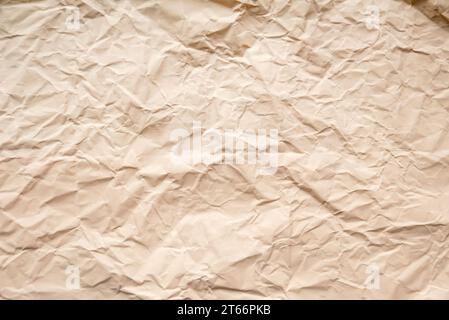 Peach color crumpled paper for background. Stock Photo