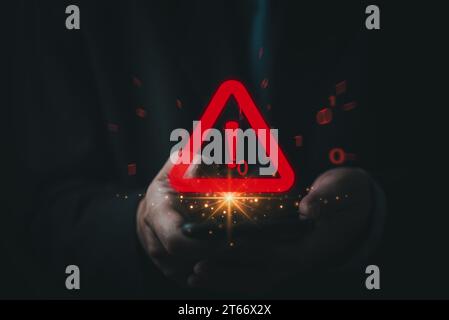 Businessman using mobile phone red triangle warning sign with exclamation point for error notification. Technology access security system, virus and d Stock Photo