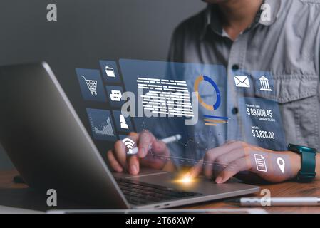businessman using laptop online digital marketing commerce sale analysis information buying products and services. Stock Photo
