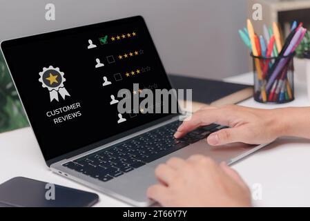 Businessman using laptop high quality assurance mark, good service five stars. business digital checklist documents service ISO Certification Concept. Stock Photo