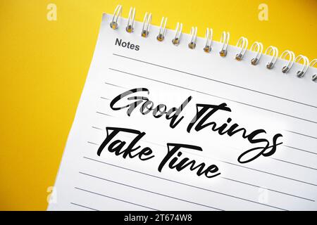 Good Things Take Time text on spiral notepad, concept for motivational slogan, Motivational Quote. Stock Photo