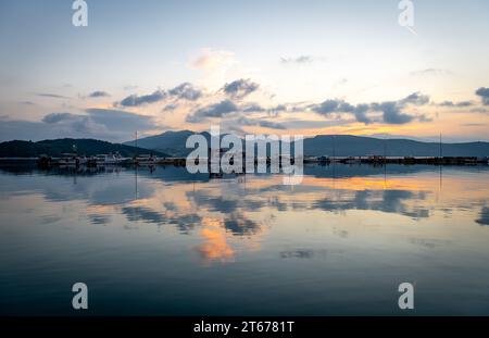 Sunrise sky and cloud reflection on still sea. Stock Photo