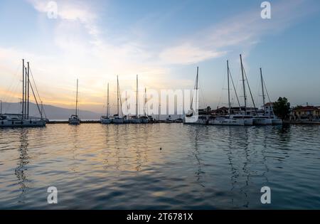 Sunrise sky clouds and reflections. Nikiana harbour. Lefkada. Greece. Stock Photo