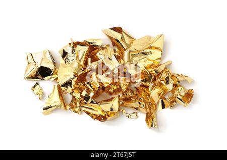 Many pieces of edible gold leaf isolated on white, top view Stock Photo