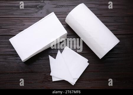 Clean tissues and paper towels on wooden table, flat lay Stock Photo