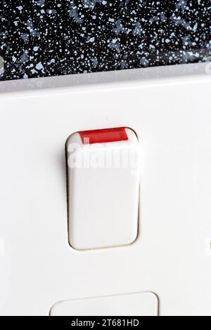 Close up of a toggle switch on a UK plug socket Stock Photo