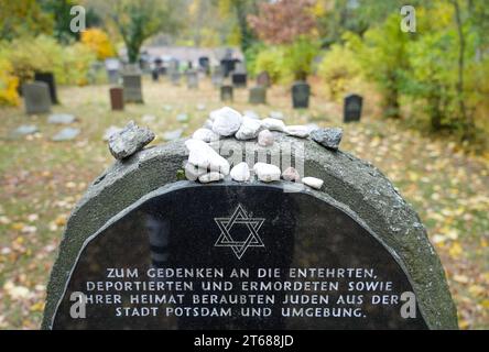Potsdam, Germany. 09th Nov, 2023. A gravestone with the inscription 'In memory of the dishonored, deported and murdered Jews from the city of Potsdam and the surrounding area who were robbed of their homes' stands in the Jewish cemetery before the start of a commemorative event to mark the 85th anniversary of the pogrom night in Brandenburg. Credit: Soeren Stache/dpa/Alamy Live News Stock Photo