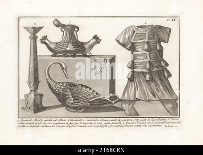 Ancient metal oil lamps in swan and animal shapes in Odescalchi Castle 1, Etruscan candelabra from a terracotta in Casa Gualtieri 2, cuirass with bells used by sentinels at the Temple of Jupiter Capitolinus 3. Copperplate engraving by Domenico Pronti from his own New Collection Representing Religious, Civil and Military Costumes of the Ancient Egyptians, Etruscans, Greeks and Romans, Nuova Raccolta Rappresentante I Costumi Religiosi Civili e Militari, Rome, 1805. Stock Photo