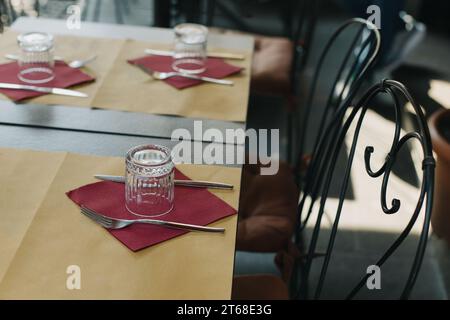 Table served for lunch in a street cafe on a sunny day. Selective focus. Stock Photo