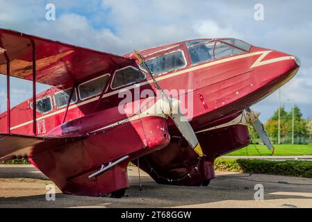 A replica de Havilland DH.89 Dragon Rapide situated at the old Liverpool Airport terminal which is now a hotel in Speke. Stock Photo