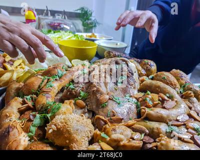 Top view of Tripes, empties, and legs with lemon and herbs on black background on table ready to be eaten Stock Photo