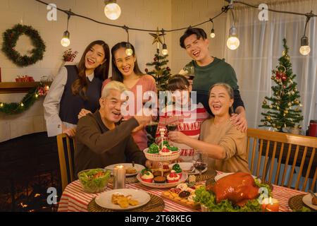 Celebrating Thanksgiving and Christmas with an Asian family  cherishing every moment with a spread of delectable food Stock Photo