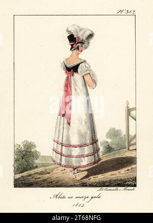 Fashionable woman in semi-formal outfit, 1815. In bonnet with plumes, high-waisted gown with black bodice, pink ribbons. Costume demie habille. Handcoloured lithograph by Lorenzo Bianchi and Domenico Cuciniello after Hippolyte Lecomte from Costumi civili e militari della monarchia francese dal 1200 al 1820, Naples, 1825. Italian edition of Lecomtes Civilian and military costumes of the French monarchy from 1200 to 1820. Stock Photo