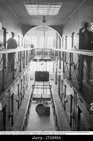 Inside a prison 1930s. The inside of Långholmens central prison in Stockholm showing the cells and doors on the different floors. Sweden 1935 Stock Photo
