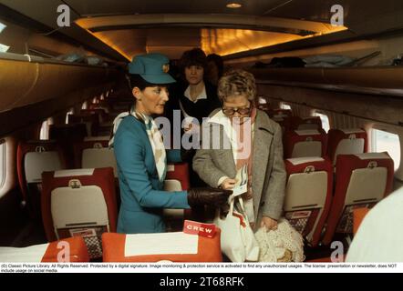 Airline travelling in the 1970s. A swedish passenger airplane 1979 of the airline SAS. The female flight attendant is greeting the passangers when boarding the aircraft. Sweden 1979 Stock Photo