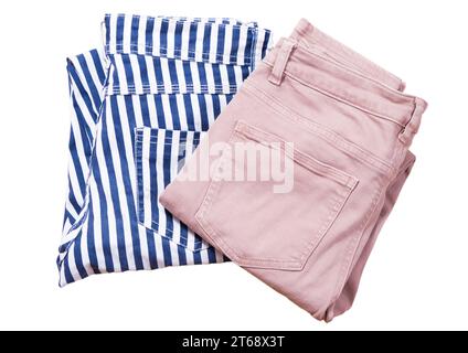 Two pair of folded casual pants on a white background top view Stock Photo